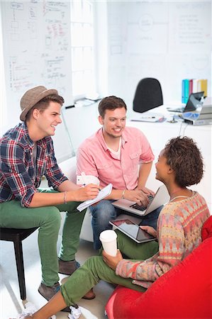 sitting on bean bag - Business people talking in office Stock Photo - Premium Royalty-Free, Code: 6113-06626067