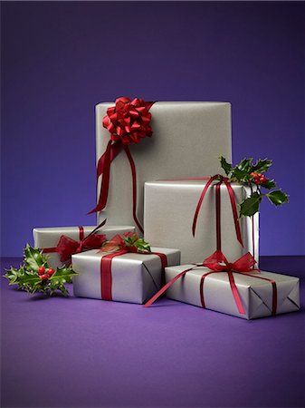 ribbon (material) - Stack of wrapped Christmas presents Stock Photo - Premium Royalty-Free, Code: 6113-06626090