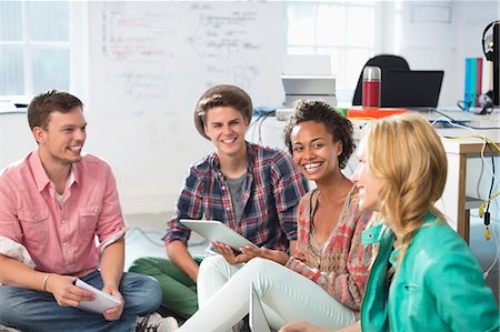 startup - Business people laughing in meeting Stock Photo - Premium Royalty-Free, Code: 6113-06626013