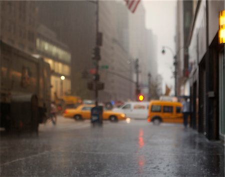 sidewalk rain - Blurred view of rainy city street Stock Photo - Premium Royalty-Free, Code: 6113-06626123