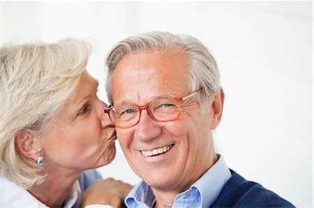 simsearch:6113-06626357,k - Smiling woman kissing husband Stock Photo - Premium Royalty-Free, Code: 6113-06626354