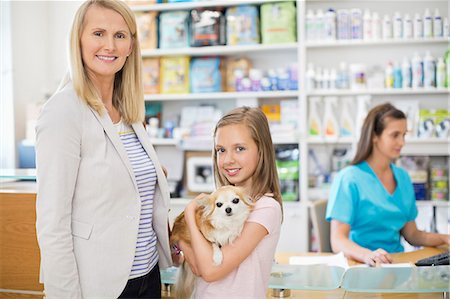 portrait of vet - Owners bringing dog to vet's surgery Stock Photo - Premium Royalty-Free, Code: 6113-06626475