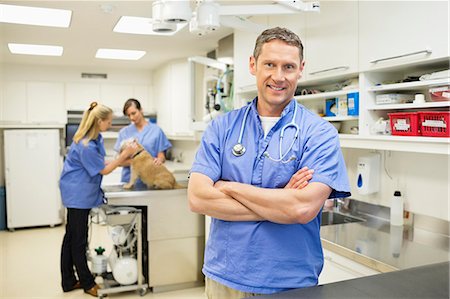 portrait of vet - Smiling veterinarian standing in vet's surgery Stock Photo - Premium Royalty-Free, Code: 6113-06626482