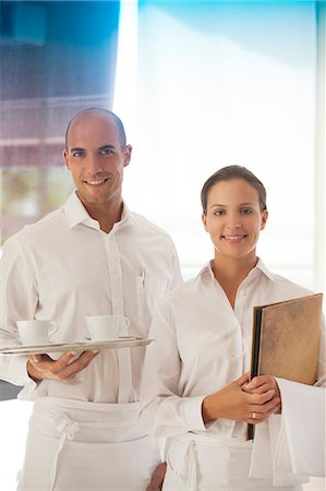 simsearch:614-06624461,k - Wait staff smiling in restaurant Stock Photo - Premium Royalty-Free, Code: 6113-06626581