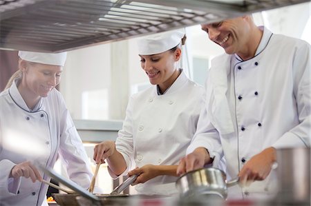 simsearch:614-03551539,k - Chefs cooking in restaurant kitchen Stock Photo - Premium Royalty-Free, Code: 6113-06626588