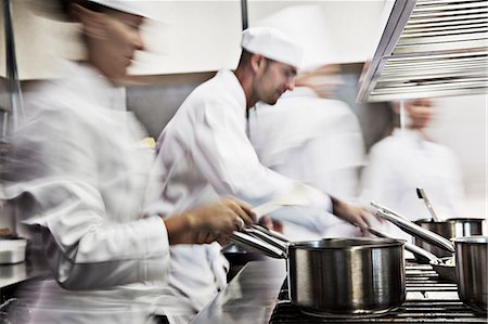 Chefs cooking in restaurant kitchen Photographie de stock - Premium Libres de Droits, Code: 6113-06626598