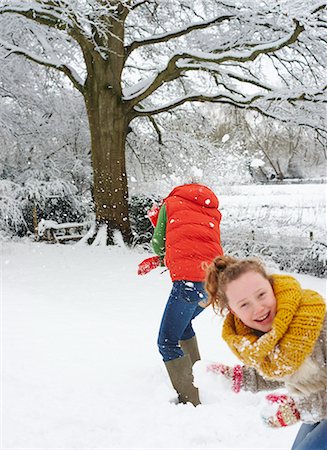 preteen girls playing at park photos - Mother and daughter playing in snow Stock Photo - Premium Royalty-Free, Code: 6113-06753370