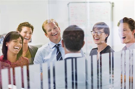 funny man with specs - Business people laughing in meeting Stock Photo - Premium Royalty-Free, Code: 6113-06753428