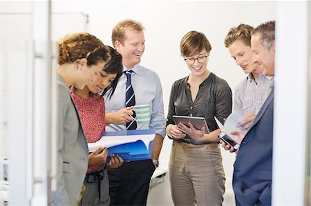Business people talking in office Stock Photo - Premium Royalty-Free, Code: 6113-06753568
