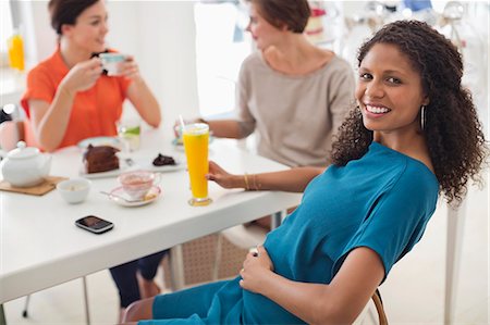 dining, side view - Pregnant woman having glass of juice Stock Photo - Premium Royalty-Free, Code: 6113-06753631