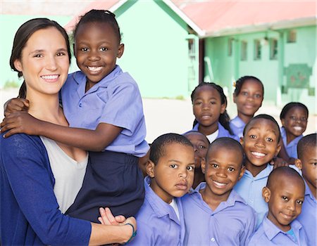 students learn group - Students and teacher smiling outdoors Stock Photo - Premium Royalty-Free, Code: 6113-06753862