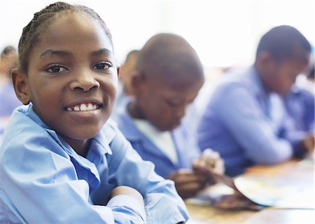 Student smiling in class Stock Photo - Premium Royalty-Free, Code: 6113-06753837