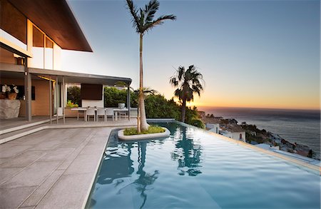 pool ocean view - Palm tree in infinity pool Stock Photo - Premium Royalty-Free, Code: 6113-06753942