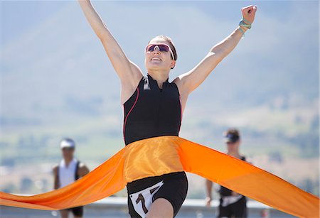 runner (female) - Runner crossing race finish line Stock Photo - Premium Royalty-Free, Code: 6113-06754062