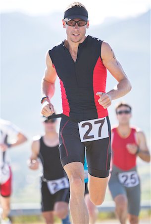 runner from below - Runner in race on rural road Stock Photo - Premium Royalty-Free, Code: 6113-06754069