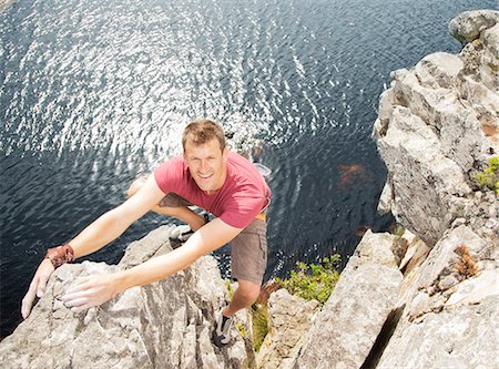 escalar - Climber scaling coastal cliff Foto de stock - Sin royalties Premium, Código: 6113-06754087