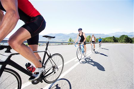 recreation bicycling - Cyclists in race on rural road Stock Photo - Premium Royalty-Free, Code: 6113-06754018