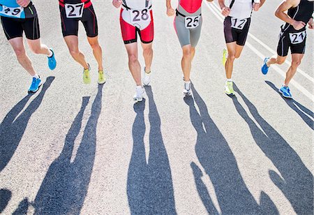 Runners in race on rural road Stock Photo - Premium Royalty-Free, Code: 6113-06754024