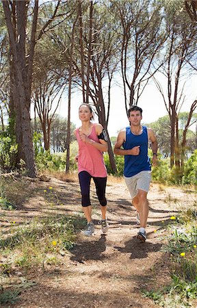 simsearch:649-06165052,k - Couple running on dirt path Stock Photo - Premium Royalty-Free, Code: 6113-06754156