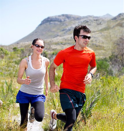 simsearch:649-06165052,k - Couple running on dirt path Stock Photo - Premium Royalty-Free, Code: 6113-06754131