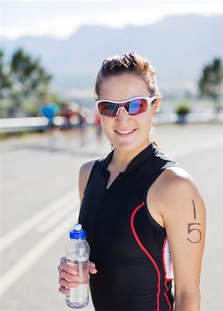 sport portrait - Runner standing on rural road Stock Photo - Premium Royalty-Free, Code: 6113-06754134