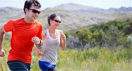 runners - Couple running in rural landscape Stock Photo - Premium Royalty-Free, Code: 6113-06754136