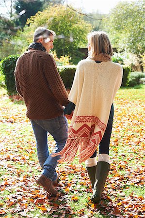 Couple holding hands outdoors Stock Photo - Premium Royalty-Free, Code: 6113-06720244