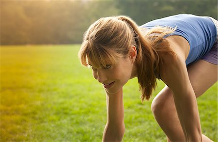 squat exercise - Runner in stance at park Stock Photo - Premium Royalty-Free, Code: 6113-06720378