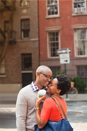 Couple hugging on city street Stock Photo - Premium Royalty-Free, Code: 6113-06720461