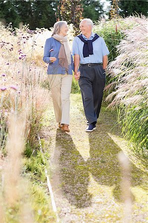 senior citizen outdoor gardens - Older couple walking outdoors Stock Photo - Premium Royalty-Free, Code: 6113-06720574