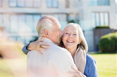 senior couple eye contact head and shoulders not indoors - Older couple hugging outdoors Stock Photo - Premium Royalty-Free, Code: 6113-06720650