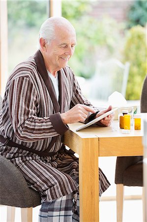 prescription - Older man using tablet computer at table Stock Photo - Premium Royalty-Free, Code: 6113-06720657
