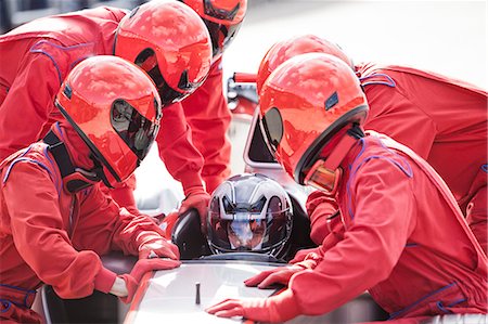 Racing team working at pit stop Stock Photo - Premium Royalty-Free, Code: 6113-06720783