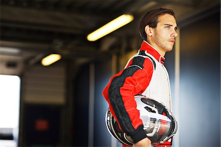 sports race - Racer holding helmet in garage Photographie de stock - Premium Libres de Droits, Code: 6113-06720786