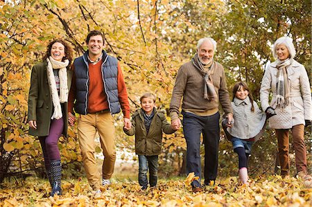 family leisure outdoors - Family walking together in park Stock Photo - Premium Royalty-Free, Code: 6113-06721162