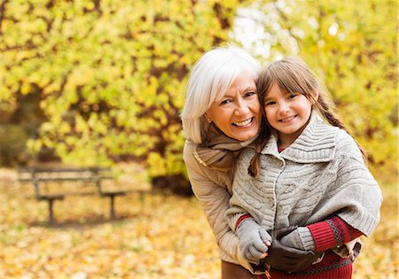 Older woman and granddaughter smiling in park Stock Photo - Premium Royalty-Free, Code: 6113-06721167