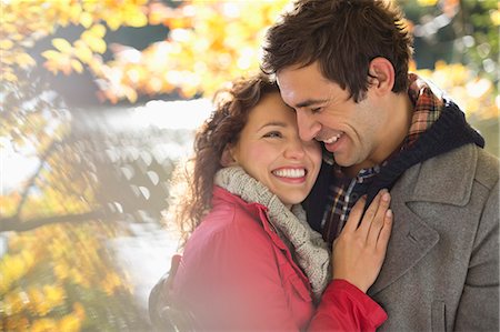 simsearch:6113-06721212,k - Smiling couple hugging in park Stock Photo - Premium Royalty-Free, Code: 6113-06721187
