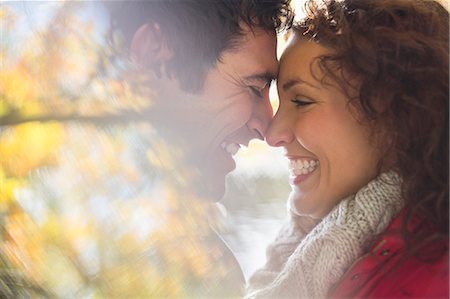 people autumn leaves - Smiling couple touching noses outdoors Stock Photo - Premium Royalty-Free, Code: 6113-06721192