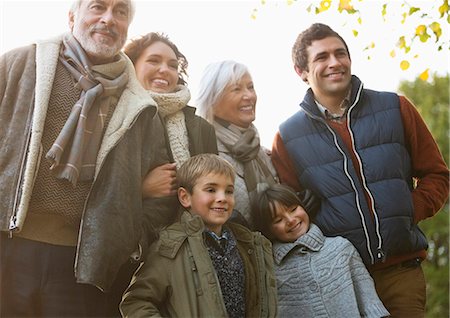 senior man son - Family smiling together in park Stock Photo - Premium Royalty-Free, Code: 6113-06721195