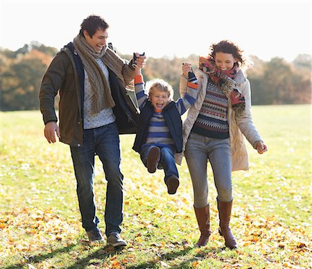 family smile - Family walking together in park Stock Photo - Premium Royalty-Free, Code: 6113-06721265