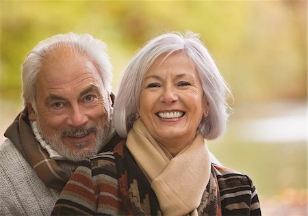 senior man portrait scarf - Older couple hugging in park Stock Photo - Premium Royalty-Free, Code: 6113-06721283