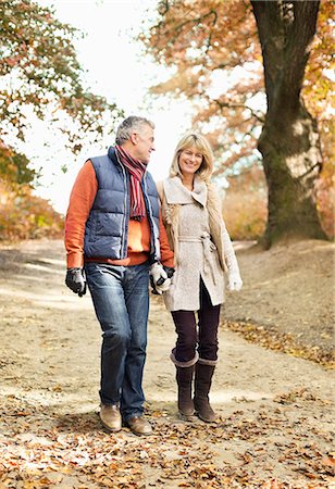 Older couple walking in park Stock Photo - Premium Royalty-Free, Code: 6113-06721287