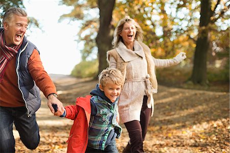 simsearch:6113-06721280,k - Boy and grandparents walking in park Stock Photo - Premium Royalty-Free, Code: 6113-06721294