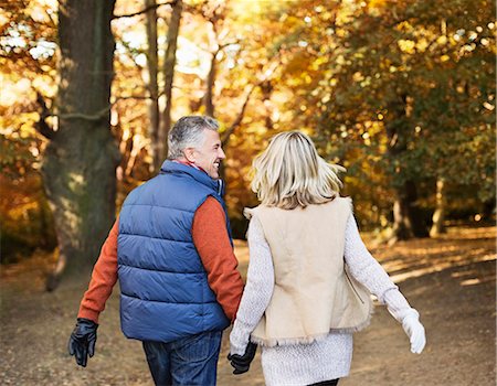 romantic couple middle aged - Older couple walking together in park Stock Photo - Premium Royalty-Free, Code: 6113-06721201