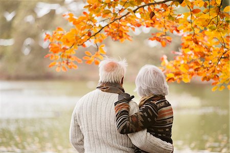 retired couple embrace - Older couple standing in park Stock Photo - Premium Royalty-Free, Code: 6113-06721222