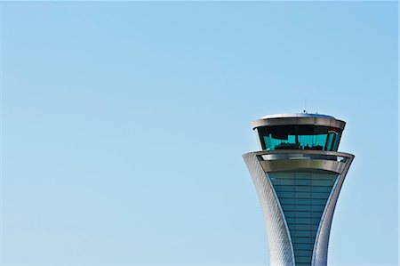 Air traffic control tower and blue sky Stock Photo - Premium Royalty-Free, Code: 6113-06721375