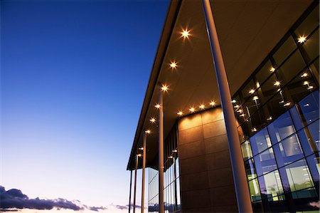 simsearch:6113-06721418,k - Modern building illuminated at sunset Stock Photo - Premium Royalty-Free, Code: 6113-06721387