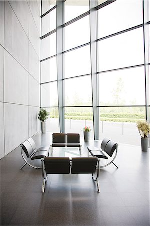 simsearch:6113-06721380,k - Chairs and table in office lobby area Stock Photo - Premium Royalty-Free, Code: 6113-06721384