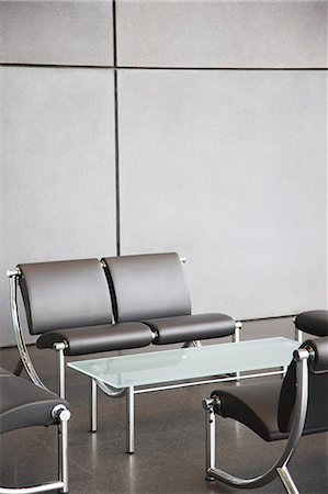 Chairs and table in office lobby area Stock Photo - Premium Royalty-Free, Code: 6113-06721399