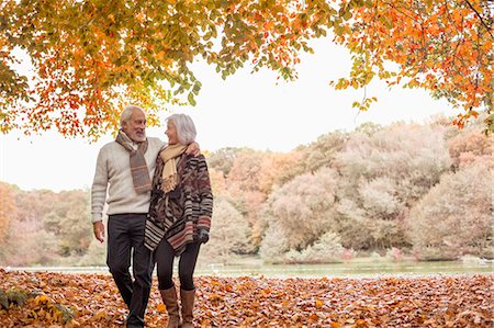 embrace joyful full length caucasian - Older couple walking in park Stock Photo - Premium Royalty-Free, Code: 6113-06721327